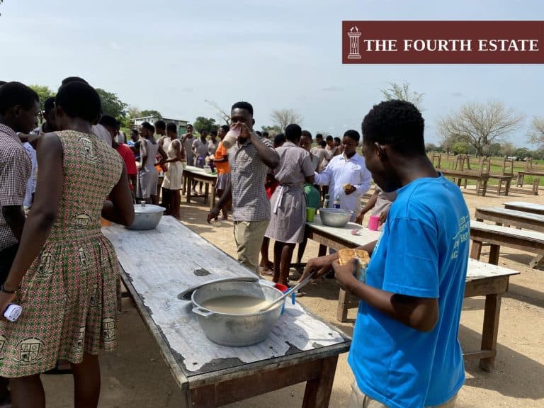 Zorkor SHS students stand, eat in the sun and rain
